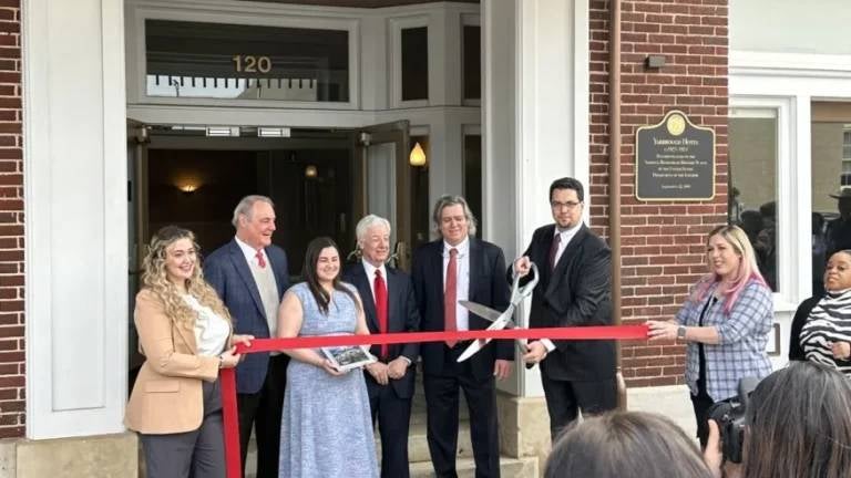 Johnston Moore & Weston Lawyers cutting a ribbon at a new location